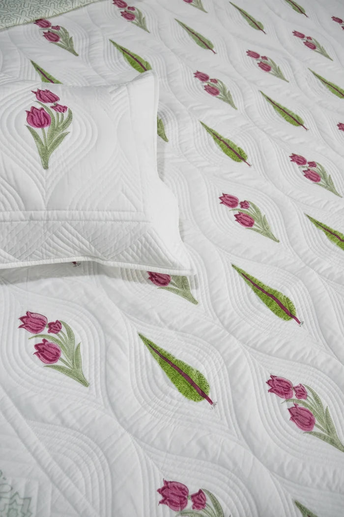 Floral Bedcover with pink tulips and green leaves on a white background