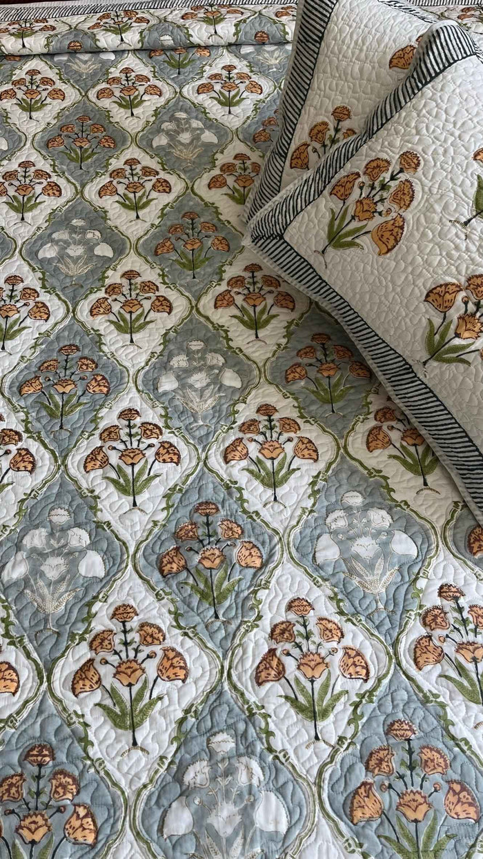 Saffron Blooms Quilted Bed Covers: Handblock Bedcover for Elegant Bedrooms